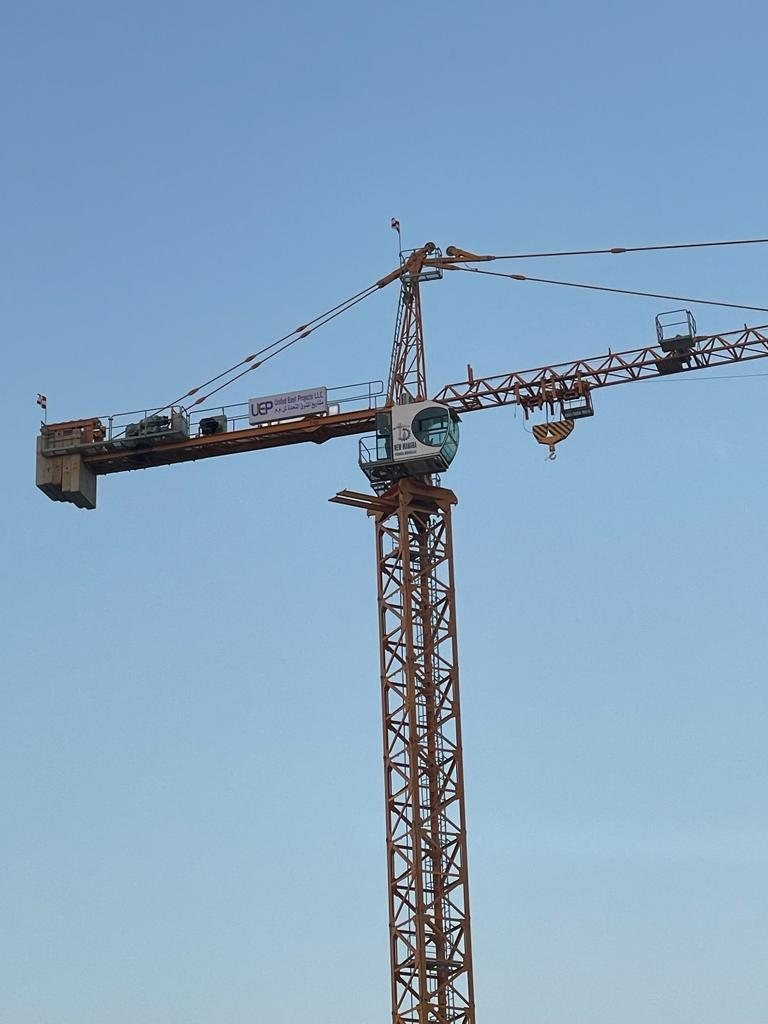 A tower crane seen against a clear sky